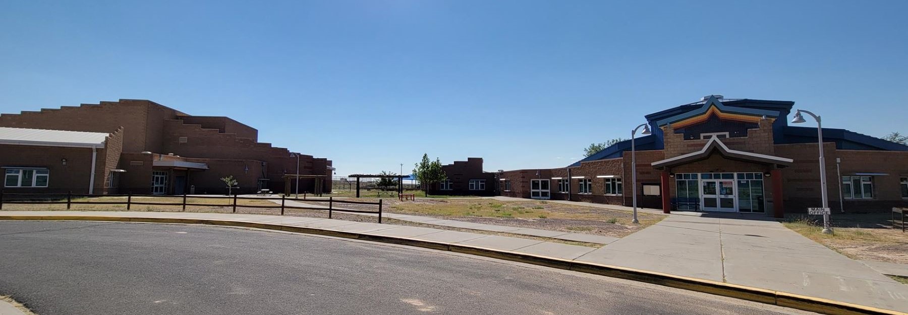 Seba Dalkai boarding school building, showcasing modern architecture and surrounding landscape.