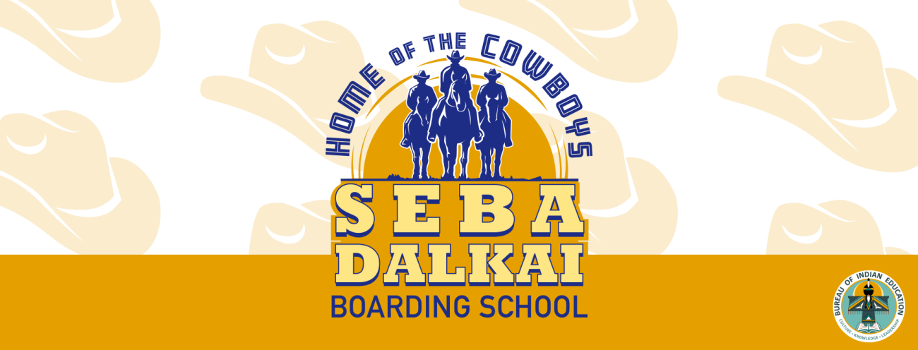Banner with the logo for Seba Dalkai Boarding School, showcasing three cowboys on horseback in dark blue.